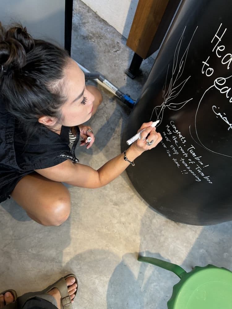 Guest writing on the chalkboard wall